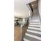 Wide staircase with gray wood treads and metal railing at 3352 Landings South Dr, Atlanta, GA 30331