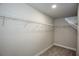Spacious walk-in closet has carpeted floors and white metal shelving for optimal storage at 3352 Landings South Dr, Atlanta, GA 30331