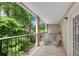 This covered balcony offers seating and serene views of the surrounding lush greenery, perfect for relaxation at 3655 Habersham Ne Rd # 244B, Atlanta, GA 30305