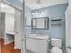 Well-lit bathroom featuring a modern vanity, toilet, and an adjoining vanity room at 3655 Habersham Ne Rd # 244B, Atlanta, GA 30305