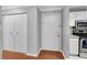 Bright entryway with white front door, coat closet and stainless steel appliances at 3655 Habersham Ne Rd # 244B, Atlanta, GA 30305