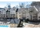 Exterior view of condominiums with parking, pool and building exteriors in neutral paint at 3655 Habersham Ne Rd # 244B, Atlanta, GA 30305