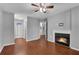 Living room with hardwood floors, featuring a fireplace and access to other rooms at 3655 Habersham Ne Rd # 244B, Atlanta, GA 30305