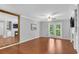 Inviting living room with wood floors, fireplace, and access to outdoor balcony at 3655 Habersham Ne Rd # 244B, Atlanta, GA 30305
