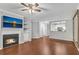 Bright living room featuring a fireplace, wood floors, and an open view of the kitchen at 3655 Habersham Ne Rd # 244B, Atlanta, GA 30305