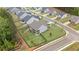 An aerial view of a well-maintained home with a spacious, fenced backyard surrounded by lush trees at 438 Southland Cir, Canton, GA 30115