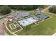 Aerial view of resort-style pool, clubhouse, bocce ball, and tennis and pickle ball courts at 438 Southland Cir, Canton, GA 30115