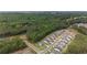 An aerial perspective captures a row of modern homes bordering a dense forest, offering a blend of nature and community at 438 Southland Cir, Canton, GA 30115