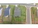 Aerial view of a home with a well-manicured lawn, fenced backyard, and convenient street access at 438 Southland Cir, Canton, GA 30115