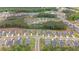 A high-angle view captures a well-planned community alongside a lush forest, emphasizing the blend of nature and modern living at 438 Southland Cir, Canton, GA 30115
