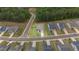 Aerial shot of the home, showcasing a meticulously landscaped lawn, fenced backyard, and prime location in a vibrant community at 438 Southland Cir, Canton, GA 30115