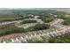 An aerial view showcases a sprawling residential development nestled within a picturesque, tree-lined landscape at 438 Southland Cir, Canton, GA 30115