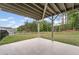 View of the home's large yard with an open patio, offering plenty of room for outdoor activities and relaxation at 438 Southland Cir, Canton, GA 30115