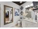 Well decorated bathroom featuring framed mirrors and a tiled shower enclosure at 438 Southland Cir, Canton, GA 30115
