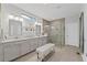 A bright bathroom with a double sink vanity and tiled glass shower enclosure at 438 Southland Cir, Canton, GA 30115