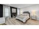 Beautifully decorated bedroom with large windows, curtains, and comfortable bed at 438 Southland Cir, Canton, GA 30115