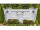 Elegant Soleil Belmont Park entrance sign set against manicured greenery at 438 Southland Cir, Canton, GA 30115