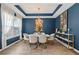 Elegant dining room with a stylish chandelier, large window, and contemporary decor at 438 Southland Cir, Canton, GA 30115