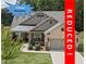 Charming home with manicured lawn, fountain, neutral brick, and attached garage is now REDUCED at 438 Southland Cir, Canton, GA 30115