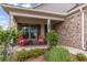 Inviting front porch with comfortable seating and stone accents at 438 Southland Cir, Canton, GA 30115
