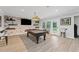 Well-lit game room features a pool table and access to the outdoors at 438 Southland Cir, Canton, GA 30115