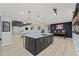 Modern kitchen island with marble countertops, stylish lighting, and bar stool seating at 438 Southland Cir, Canton, GA 30115