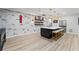 Contemporary kitchen island with marble countertops, stylish lighting, and bar stool seating at 438 Southland Cir, Canton, GA 30115