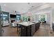 Bright and airy kitchen featuring a large island and an open view to the living room at 438 Southland Cir, Canton, GA 30115