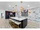 Stunning kitchen island with sleek countertops, pendant lighting, and breakfast bar seating at 438 Southland Cir, Canton, GA 30115