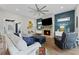 Cozy living room with a stone fireplace, modern decor, and plenty of natural light at 438 Southland Cir, Canton, GA 30115