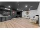 Contemporary living room with bar, sleek entertainment center, and comfortable seating at 438 Southland Cir, Canton, GA 30115