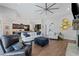 Open-concept living room with a cozy fireplace, contemporary furniture, and modern lighting at 438 Southland Cir, Canton, GA 30115