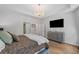 This bedroom features a chandelier, tray ceilings, and a television at 438 Southland Cir, Canton, GA 30115