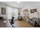 Home office with a large window, desk, and chairs for guests and clients at 438 Southland Cir, Canton, GA 30115