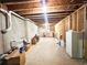Long basement hallway with exposed pipes and unfinished walls, awaiting renovation at 7860 Bristol Valley Dr, Cumming, GA 30028