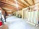 Unfinished basement with exposed framing, ready for your personal touches and customization at 7860 Bristol Valley Dr, Cumming, GA 30028