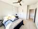 Bedroom featuring neutral carpeting, ceiling fan, and double closets at 7860 Bristol Valley Dr, Cumming, GA 30028