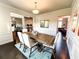 Traditional dining room featuring hardwood floors, decorative wainscoting, and a wooden table at 7860 Bristol Valley Dr, Cumming, GA 30028