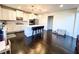 Bright kitchen with white cabinets, stainless steel appliances, and a center island with bar stool seating at 7860 Bristol Valley Dr, Cumming, GA 30028
