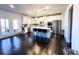 Bright kitchen with white cabinets, stainless steel appliances, and a center island with bar stool seating at 7860 Bristol Valley Dr, Cumming, GA 30028