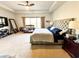 Spacious main bedroom featuring a ceiling fan and a large window for natural light at 7860 Bristol Valley Dr, Cumming, GA 30028
