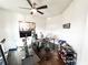 Modern home office space with workout equipment and a ceiling fan at 7860 Bristol Valley Dr, Cumming, GA 30028