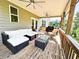 Spacious covered patio with outdoor seating, ceiling fans, and a grill at 7860 Bristol Valley Dr, Cumming, GA 30028