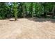 Large backyard ready for landscaping and outdoor enjoyment surrounded by mature trees at 1241 Bethsaida Rd, Riverdale, GA 30296