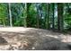 Large backyard ready for landscaping and outdoor enjoyment surrounded by mature trees at 1241 Bethsaida Rd, Riverdale, GA 30296