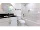 Bright bathroom with a modern vanity, marble tile accents, and a jacuzzi-style tub at 1241 Bethsaida Rd, Riverdale, GA 30296