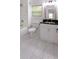 Bright bathroom featuring a modern vanity with black countertop, and bright natural light at 1241 Bethsaida Rd, Riverdale, GA 30296