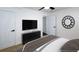 Bedroom featuring a ceiling fan, convenient walk-in closet, sleek console, and stylish décor at 1241 Bethsaida Rd, Riverdale, GA 30296