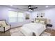 Cozy bedroom with neutral tones, a plush bed, and bright, natural light at 1241 Bethsaida Rd, Riverdale, GA 30296