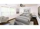 Bright bedroom with stylish decor, featuring a modern ceiling fan and ample natural light from the windows at 1241 Bethsaida Rd, Riverdale, GA 30296